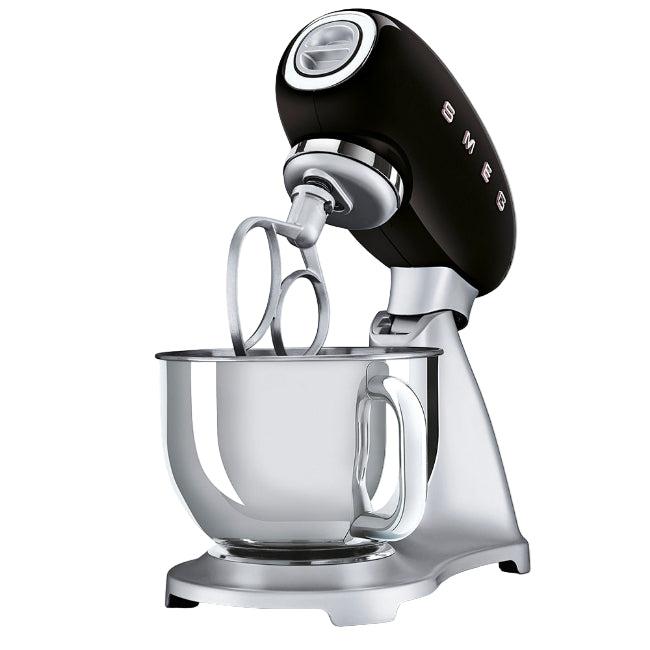 Black and silver stand mixer with glass bowl on a white background