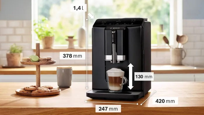 Black coffee machine on a kitchen counter with dimensions displayed
