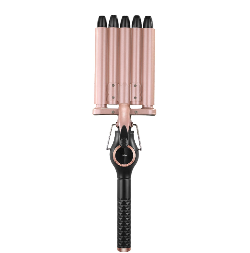 Rose gold and black hair curler on a white background