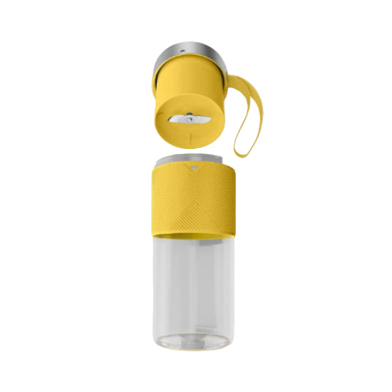 Yellow and clear glass water bottle with silver cap on a white background