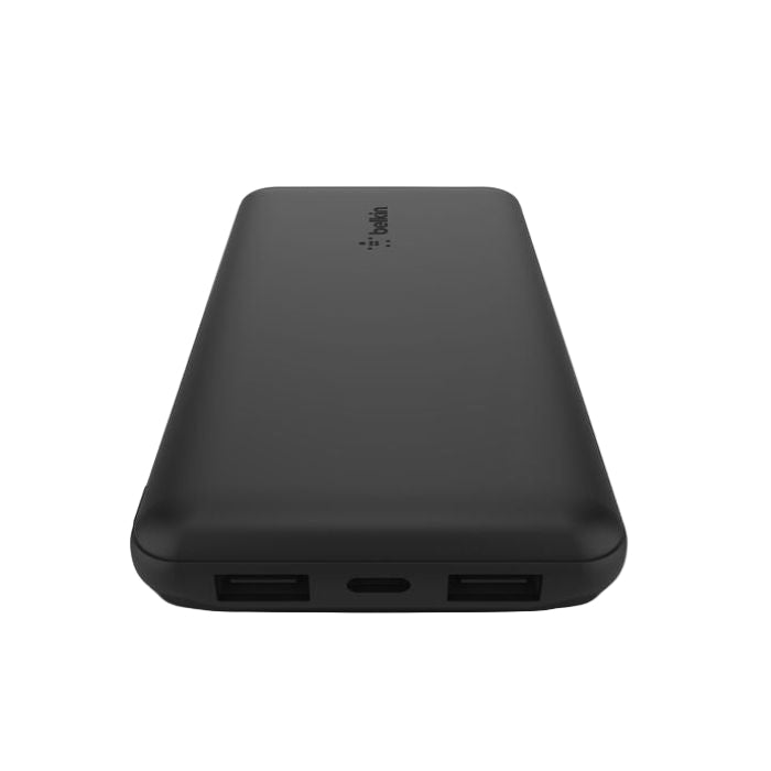 Black power bank with multiple ports on a white background