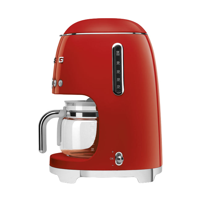Red coffee machine with a clear glass carafe on a white background
