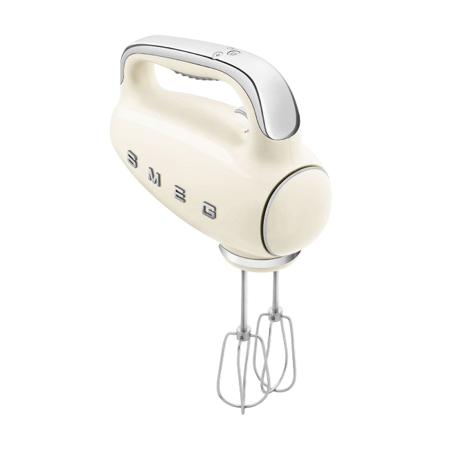 Cream-colored hand mixer with metallic accents on a white background