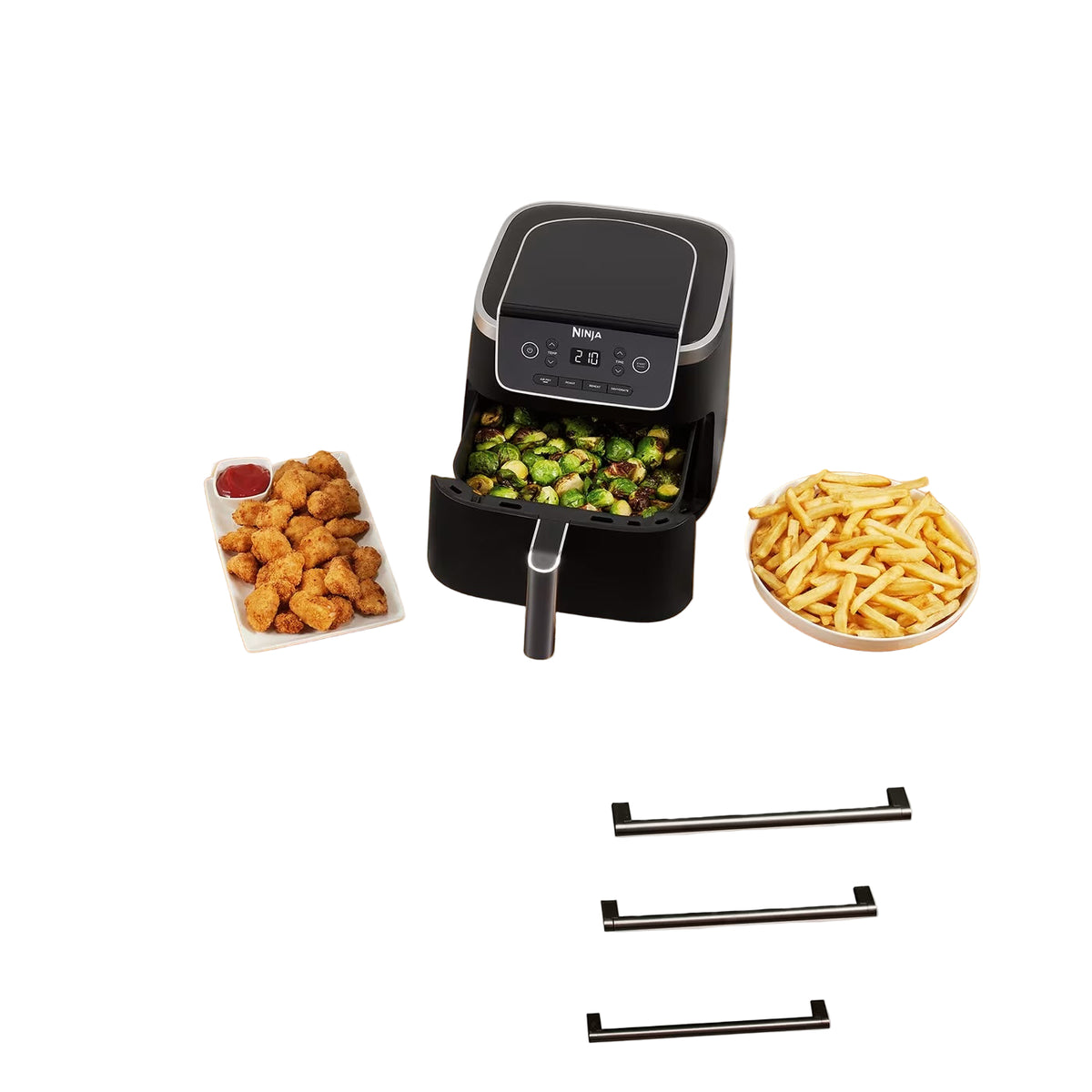 Black air fryer on a wooden countertop with various foods around it.